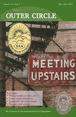Cover image of May 2024 TOC - Staircase with sign that says meeting upstairs with ISO of SAA logo